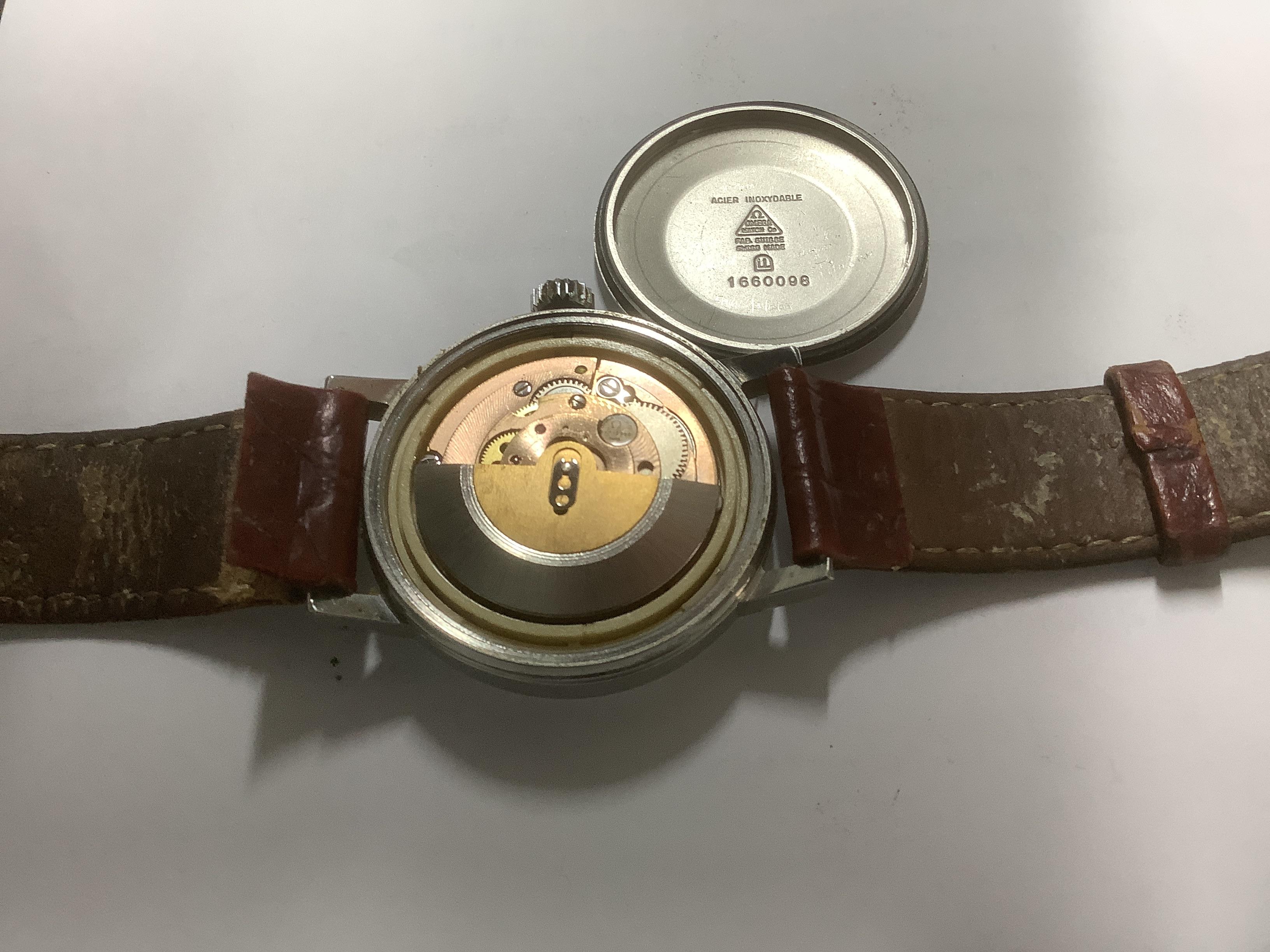 A gentleman's stainless steel Omega automatic wrist watch, with date aperture, on associated leather strap with detached buckle, case diameter 36mm, box but no papers.